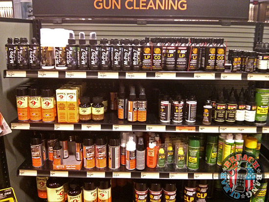 Gun cleaning shelf full of gun lube and cleaners