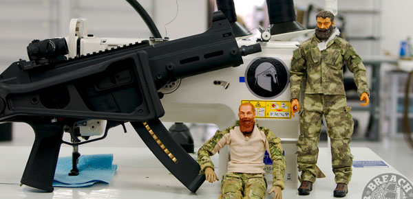 Mad Duo with a sewing machine and firearm.