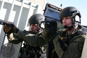 Tactical Officers using offensive handguns (Glock 22s) during building clearing exercise