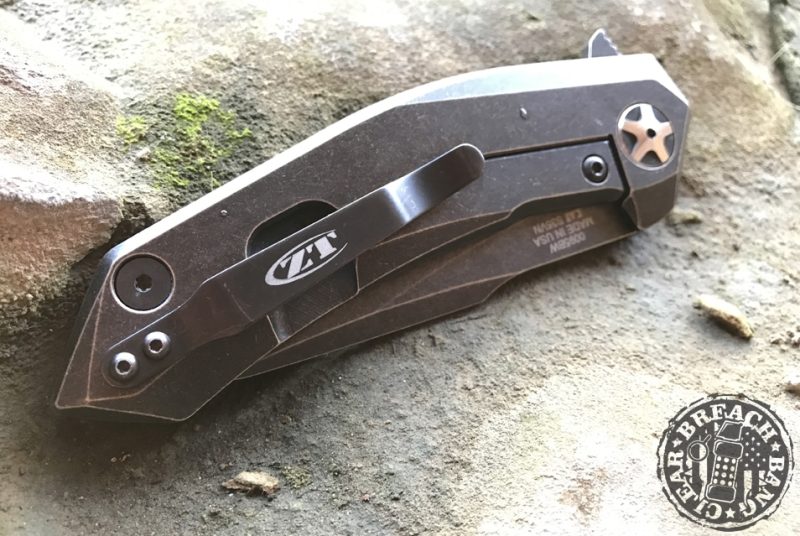 Folded knife on stone.