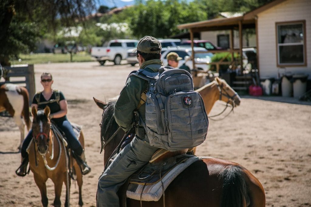 Author Chris Hernandez on horseback wearing the 5.11 Rush 72.