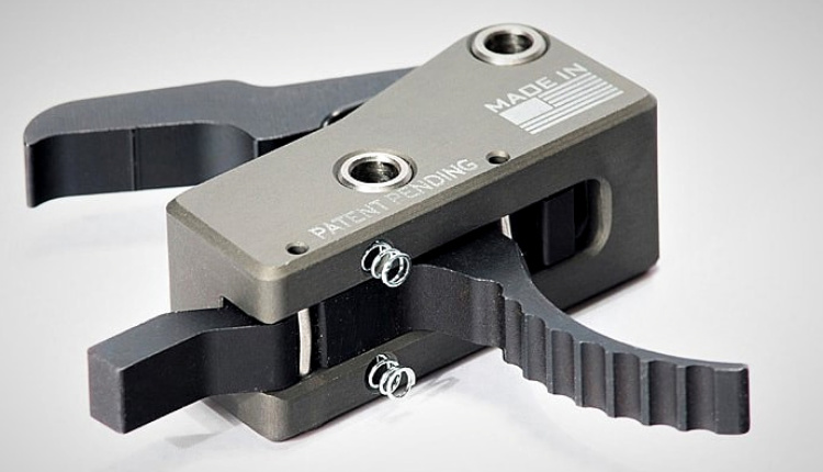The SLT-1 Drops into mil-spec fire control pockets. It's retained with standard fire-control pins captured by springs inside the housing bushings.
