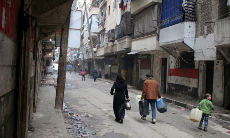 Water is one of the casualties of the Syrian war. Citizens of Aleppo must carry water to their homes in containers.