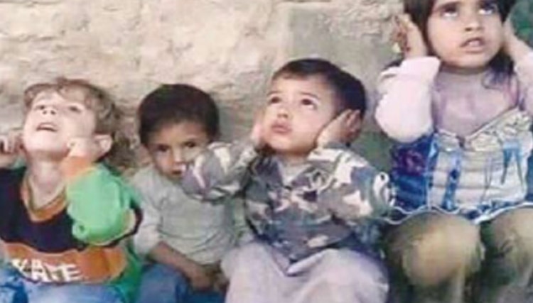 Children during the Syrian war block their ears from the sound of approaching warplanes, shelling, or cluster bombs.