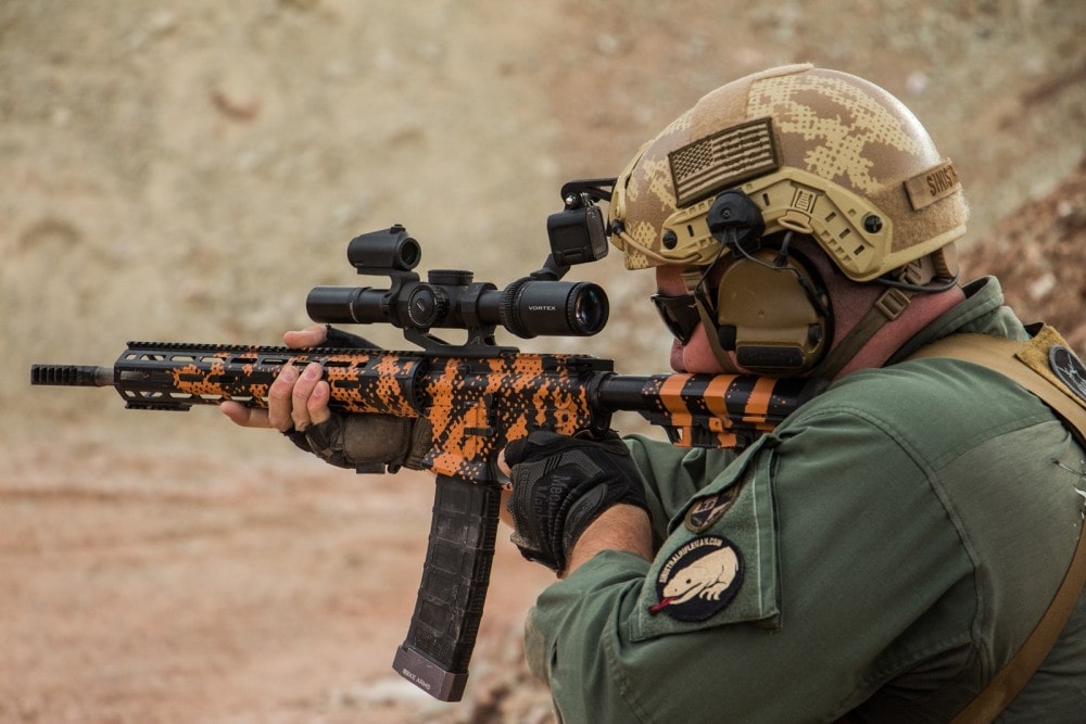 KE Arms' Russell Phagan, competing in the Trooper Armored Division, engages the spinner off hand with his KE-15 Shooting Team Rifle in Gila Monster Cerakote by We Plead the 2nd, with Vortex Viper PST 1-6X at the Hard as Hell Heroes 2 gun match, Southern Utah Practical Shooting Range.