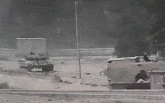 Animation of a modern tank firing, first at real speed then in slow motion.