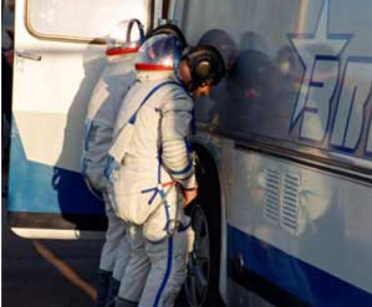 Per tradition, cosmonauts relieve themselves on the right rear tire before entering the transport bus.