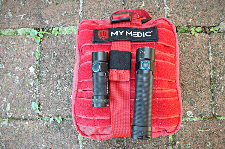 Olight flashlights with MyMedic medical kit.