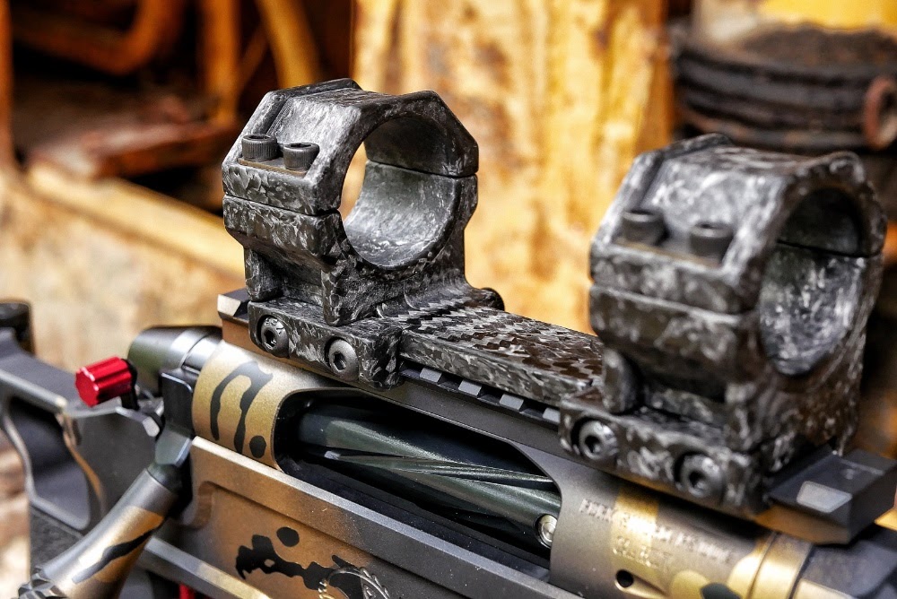 Forged carbon fiber scope rings atop a Pork Sword bolt action pistol. 