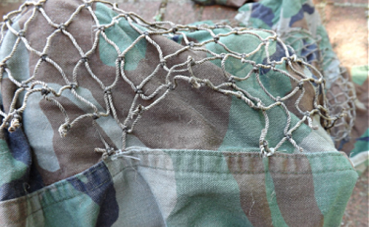 Ghillie suit netting attachment points.