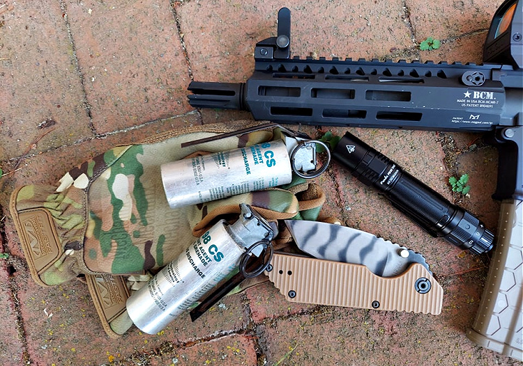 Fenix PD36 Tactical flashlight with other tactical gear.