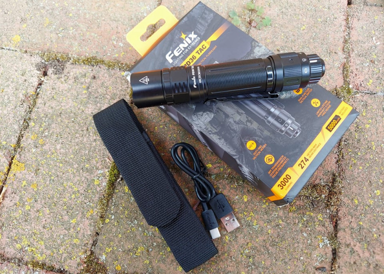 Fenix PD36 tactical flashlight with nylon belt holster and charger calbe.