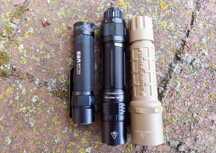 Olight S2R, Fenix PD36, and Surefire 6P Nylon tactical flashlights.