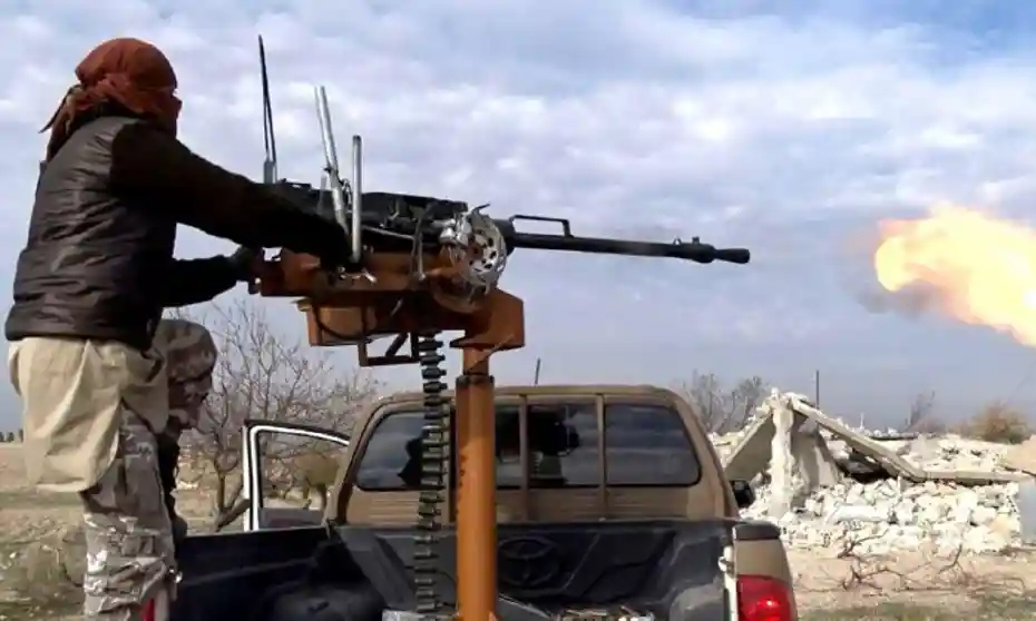 ISIS fighter on technical opens fire (unknown location or photo source).