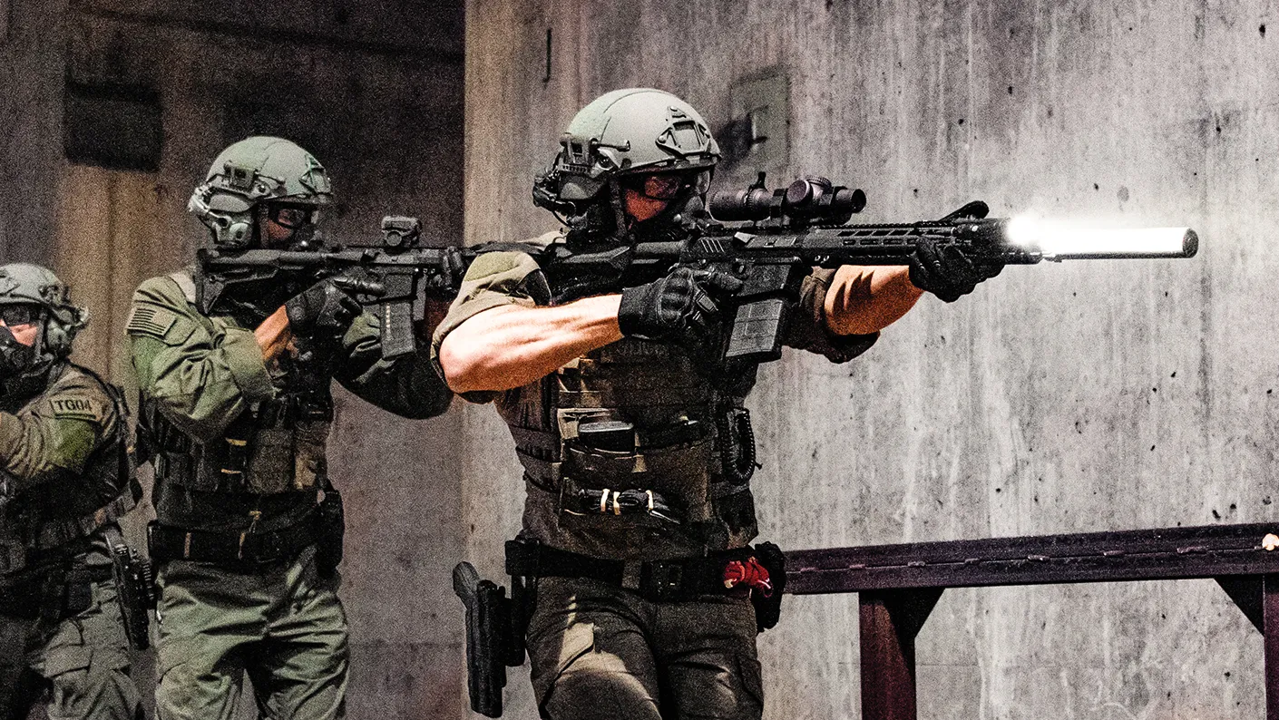 Suppressed rifle with optic