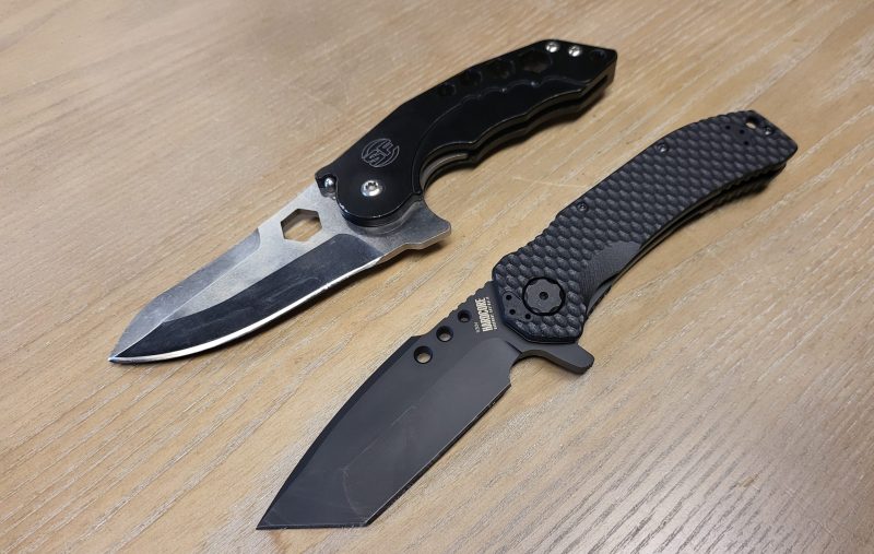 two knives laying on table