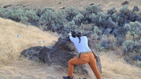 aking a shot off of a rock at a buffalo steel target in Snake River Idaho with my NRL Hunter gear laying behind me.