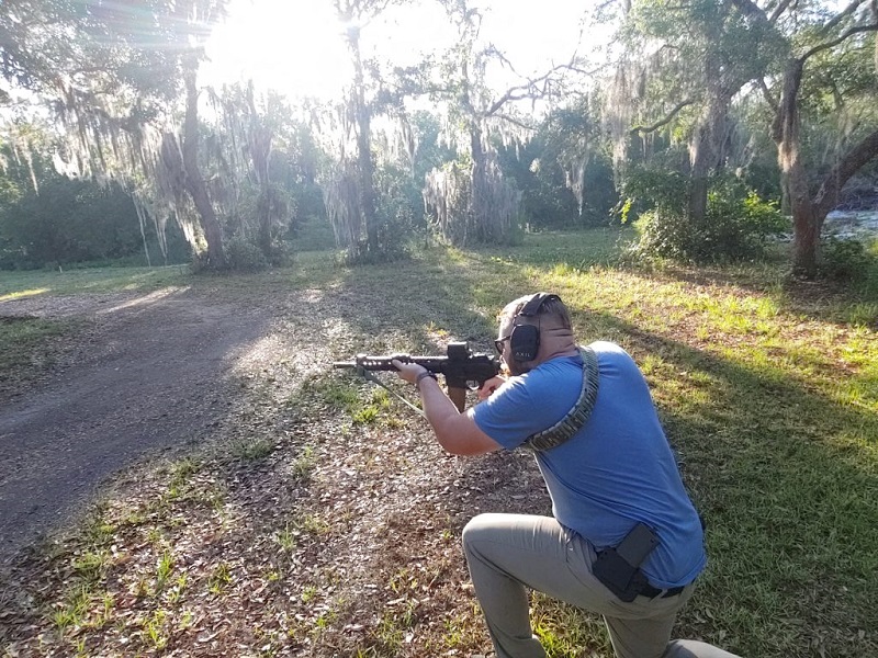 Shooting from kneeling on range day.