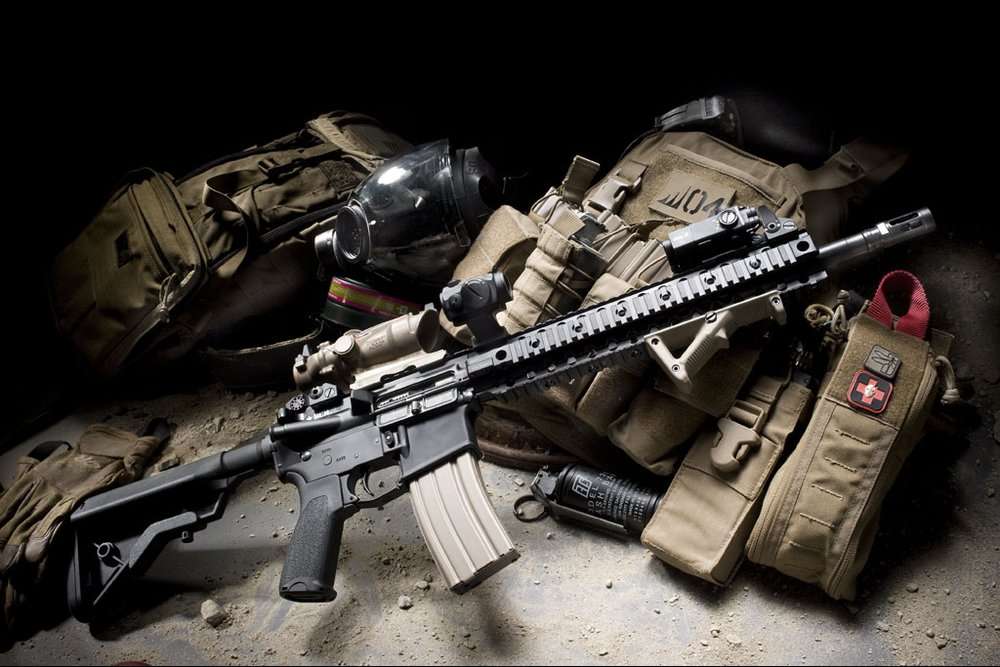 Recon rifle in front of other tactical gear.