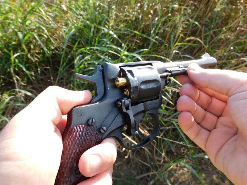 nagant revolver ejecting brass cases