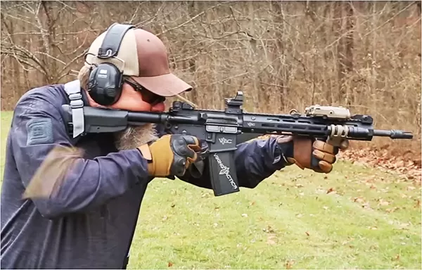 Kyle Lamb demonstrates proper cheek weld in the context of buttstock placement.