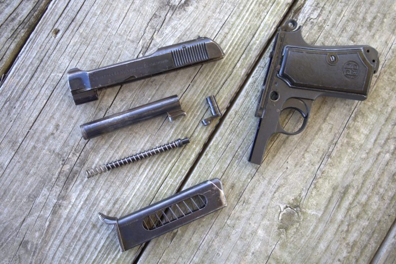 beretta m1934 disassembled on a table