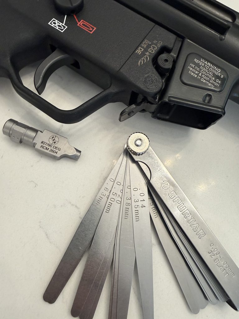Feeler gauges and an RCM MP5 90-degree locking piece.