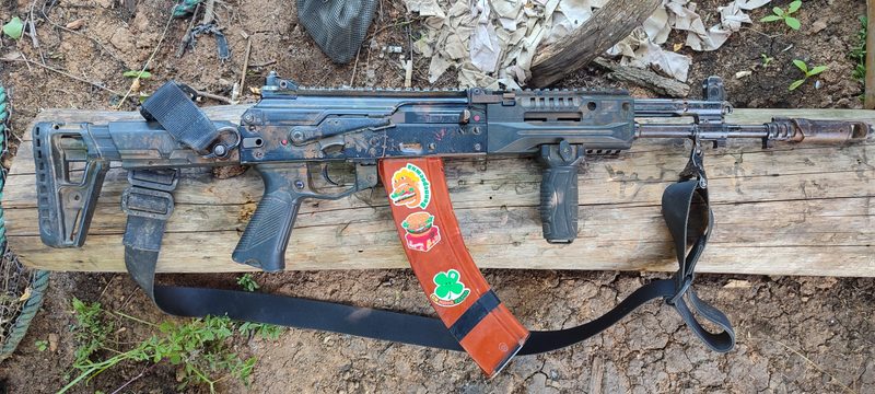 AK 12 with 45-round magazine adorned with stickers apparently from Burger King.